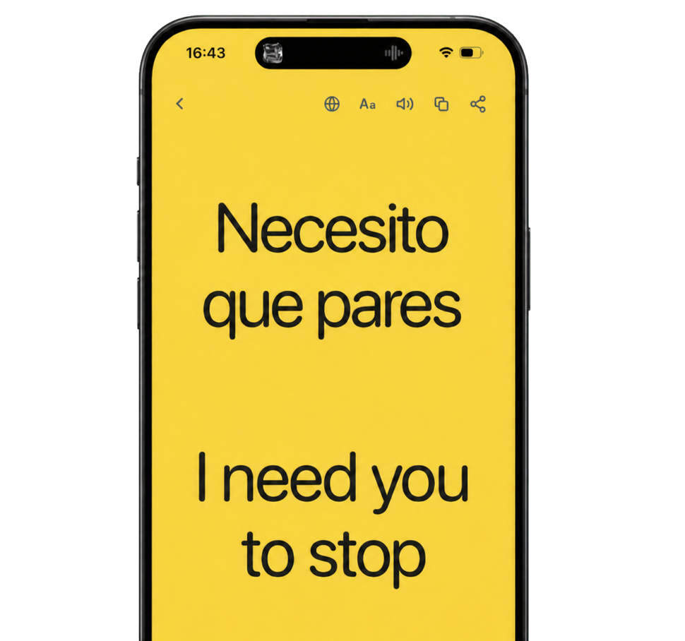 The Showju app on a phone, showing a full-screen yellow message: 'Necesito que pares' above its English translation, 'I need you to stop'.